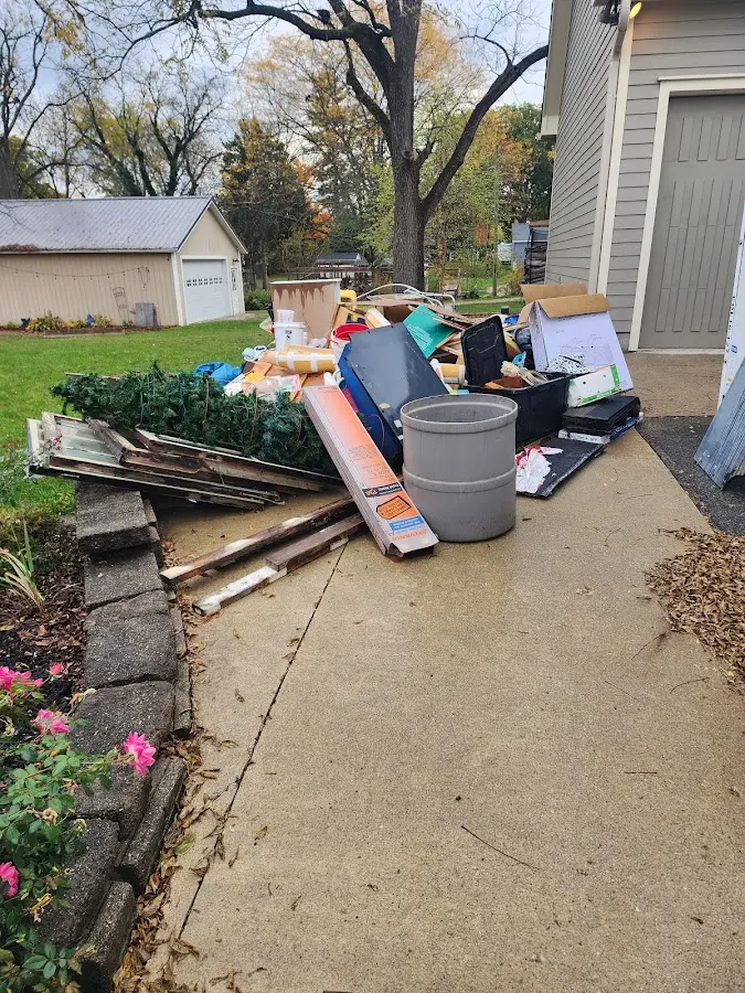 Dumpster being loaded with debris for Residential Dumpster Rental in Cheyenne